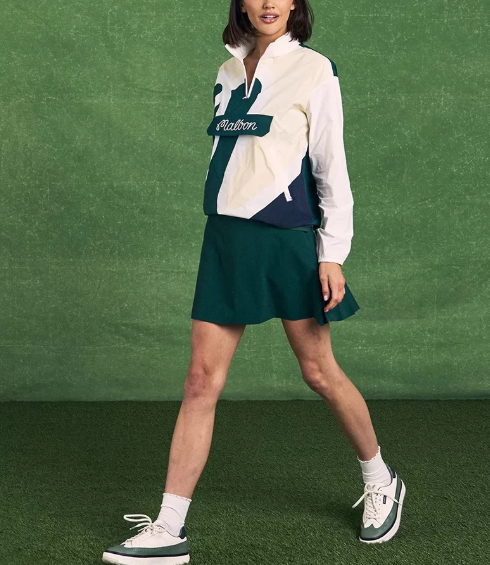 Full outfit view of Malbon women's lightweight windproof golf jacket