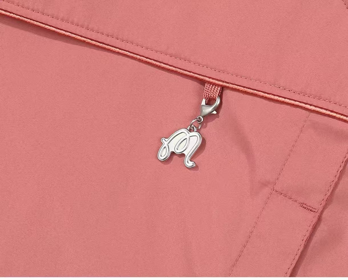 Pink Malbon golf jacket zipper charm detail