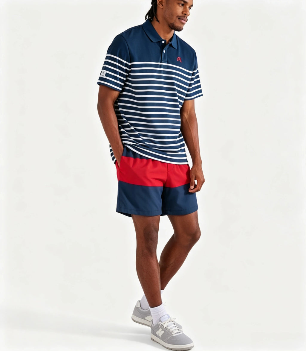 Model wearing Malbon navy striped golf polo