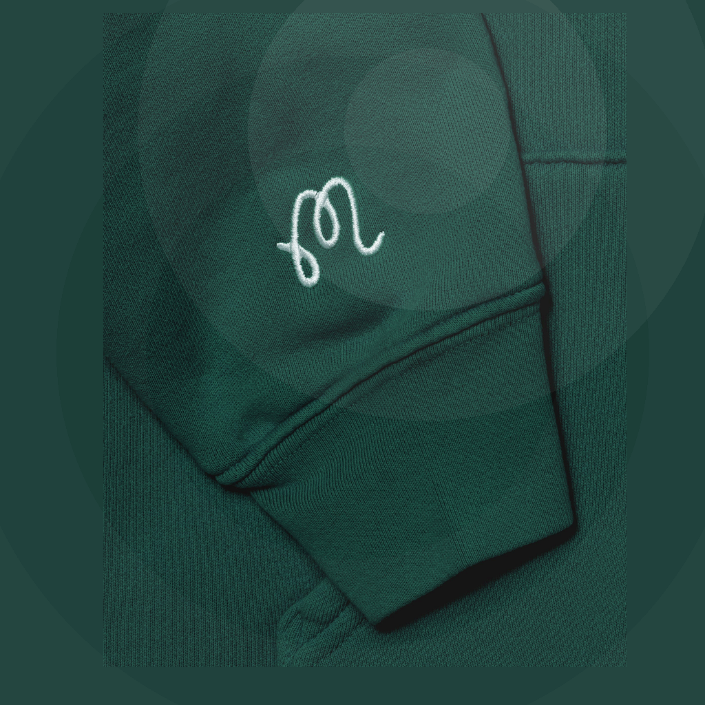 Malbon Fesque Hoodie Forest golf apparel logo and sleeve detail